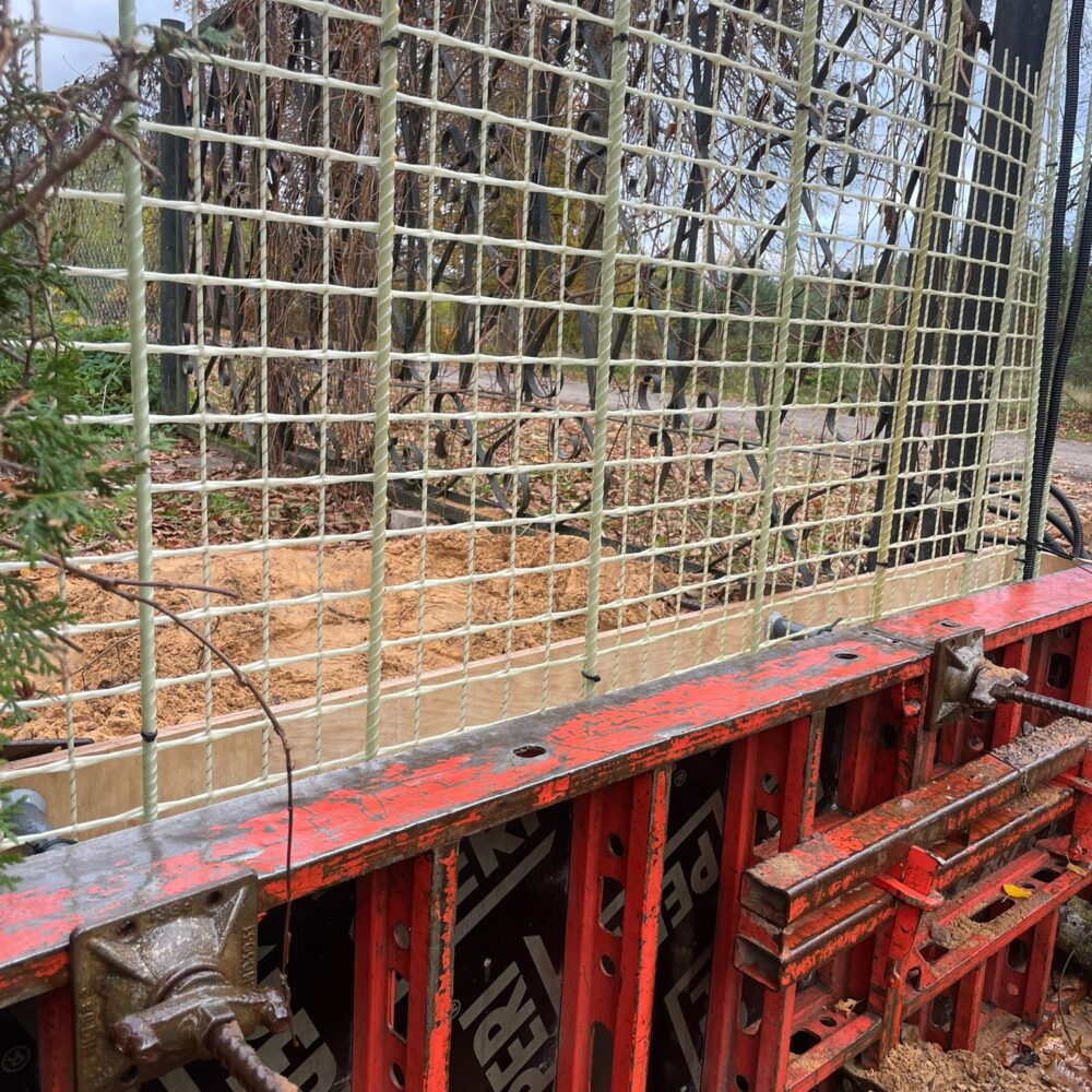 REBARMAT GFRP mesh and composite rebars installed in concrete formwork for corrosion-free foundation and retaining wall construction.